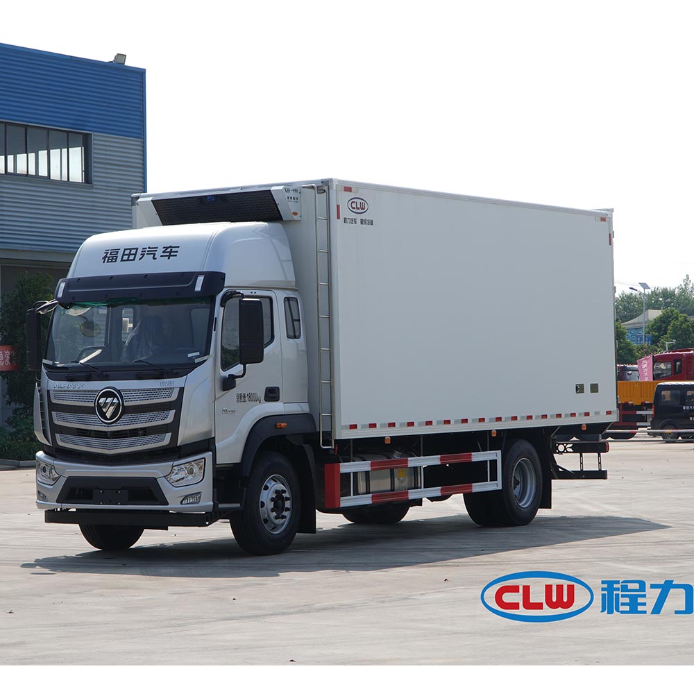 A white high-roof refrigerated truck on the road